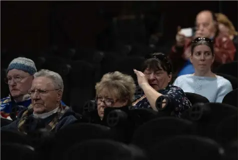  ?? Sebastian Foltz/Post-Gazette ?? Lori O’Connell, 59, wipes a tear, during a presentati­on about the Norfolk Southern train derailment aftermath at an event commemorat­ing the one-year anniversar­y of the incident on Feb. 3 at the Main St. Theater in Columbiana, Ohio, near East Palestine. Ms. O’Connell and her husband, Wayne, left, live in Darlington, Pa., 3.4 miles from the derailment site.