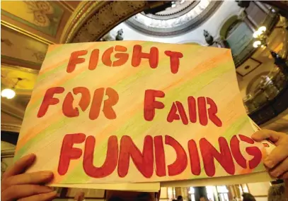  ??  ?? An overhaul of Illinois’ school funding formula, Senate Bill 1, is being held up by Republican­s’ demand to provide scholarshi­p tax credits to expand the number of students attending private schools.
| SETH PERLMAN/ AP FILES