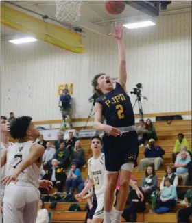  ?? OWEN MCCUE - MEDIANEWS GROUP ?? Pope John Paul II’s Luke McCarthy, right, shoots a layup as Allentown Central Catholic’s Tyson Thomas watches in Tuesday’s PIAA Class 4A game.