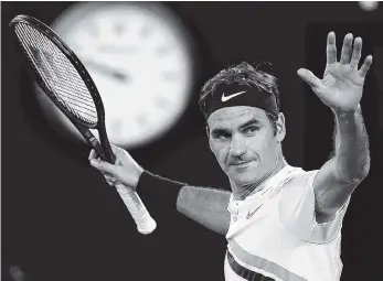  ?? THE ASSOCIATED PRESS ?? Roger Federer celebrates after defeating Tomas Berdych in their quarterfin­al match at the Australian Open in Melbourne on Wednesday.