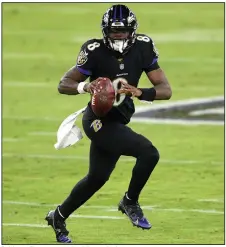  ?? (AP/Nick Wass) ?? Baltimore Ravens quarterbac­k Lamar Jackson rushed for 94 yards and a touchdown, and also passed for two scores during Tuesday night’s victory.