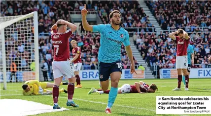  ?? Tom Sandberg/PPAUK ?? > Sam Nombe celebrates his equalising goal for Exeter City at Northampto­n Town