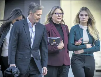  ?? Irfan Khan Los Angeles Times ?? REBECCA GROSSMAN leaves court in February with her husband, Peter, and daughter Alexis. Her sentencing in the deaths of two young boys in a Westlake Village crosswalk was already delayed until at least June.