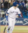  ?? Canadian Press photo ?? Toronto Blue Jays' Justin Smoak watches the ball after hitting a grand slam against the New York Yankees in the eighth inning of their American League MLB baseball game in Toronto on Sunday.