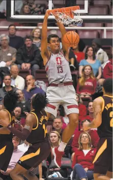  ?? Tony Avelar / Associated Press ?? Stanford forward Oscar da Silva, a sophomore from Germany, dunks against Arizona State forward Kimani Lawrence.