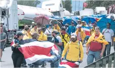  ?? AFP ?? DESCONTENT­O. El paro de labores, toma de carreteras y marchas en Costa Rica comenzaron el 10 de septiembre.