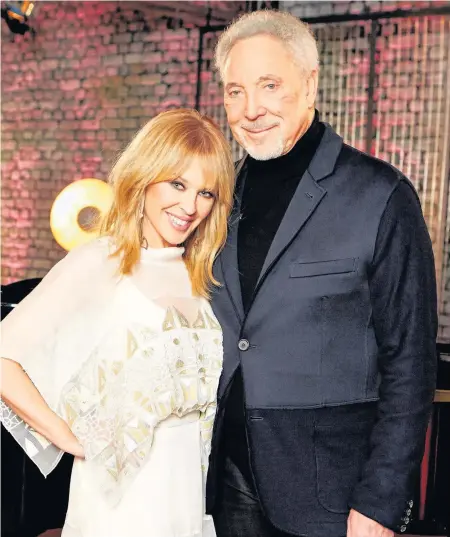  ?? Rachel Joseph/ITV ?? > Kylie Minogue and Sir Tom Jones, as she is to make a return to The Voice to join his team as a guest mentor