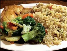  ?? Arkansas Democrat-Gazette/HELAINE R. WILLIAMS ?? The six main dishes at Alexander’s Kontiki African Restaurant include Couscous & Chicken or Fish, livened with vegetables.