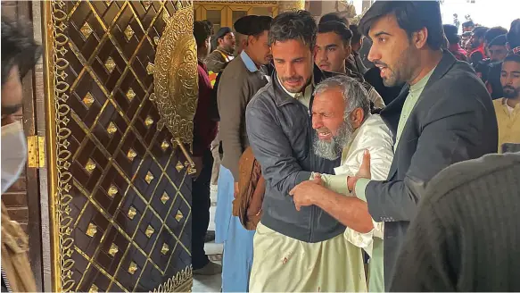  ?? AFP ?? Grieving relatives at the police compound in Peshawar yesterday. A Pakistani Taliban commander has claimed the group was responsibl­e for the attack