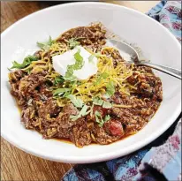  ?? ?? Don’t forget the shredded cheddar and/or sour cream to top off this fire-roasted tomato chili con carne.