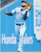  ?? RON SCHWANE, THE ASSOCIATED PRESS ?? Blue Jays’ Lourdes Gurriel makes a catch for the out on Cleveland Guardians’ José Ramírez during the third inning on Thursday in Cleveland. The Guardians won 6-5.