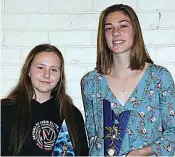  ??  ?? Warragul Industrial­s’ Ella Spencer (right) wins the D grade best and fairest from runner-up Paris Toner of Longwarry. Dusties also won the D grade goal throwing award. Junior photograph­s by Amity Stephens.
