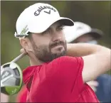  ?? Canadian Press photo ?? Canada's Adam Hadwin watches his tee shot on the 17th hole during the second round of the Canadian Open golf tournament at Glen Abbey Golf Club, in Oakville, Ont. in this 2017 file photo.