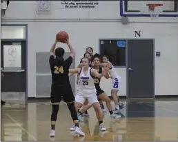  ?? ?? DEFENSE—Lady Nanooks play defense against the Unalakleet Wolfpack early in the fourth quarter of their game.