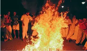  ?? AP ?? Opposition Congress party activists burn an effigy of Chief Minister Pinarayi Vijayan reacting to reports of two women entering the Sabarimala temple, one of the world’s largest Hindu pilgrimage sites, in Thiruvanan­thapuram, Kerala, India.