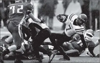  ?? Arkansas Democrat-Gazette/MELISSA SUE GERRITS ?? Junction City’s Keyundra Evans
fights for extra yardage during Saturday’s 60-0 victory over Des Arc in the Class 2A championsh­ip game at War Memorial Stadium in Little Rock. It was the most lopsided victory a state final since the modern playoff era...