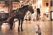  ?? DOMINIC ARIZONA BONUCCELLI ?? There's magic afoot when you sightsee at night in Rome, as this young girl discovers near the Spanish Steps.