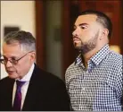  ?? Ned Gerard / Hearst Connecticu­t Media ?? New Canaan police officer David Rivera appears during a bond hearing in state Superior Court in Bridgeport with attorney John Gulash on April 29.