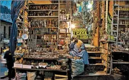  ?? JUAN KARITA/AP ?? A shopkeeper offers Andean amulets at the Witches' Market in La Paz,