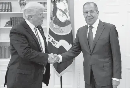  ?? RUSSIAN FOREIGN MINISTRY, AP ?? U.S. President Donald Trump, left, meets with Russian Foreign Minister Sergei Lavrov in the Oval Office last week.