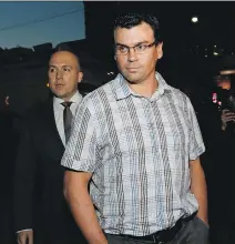  ?? STAN BEHAL ?? Ken Pagan and his lawyer, Tyler Smith, arrive at Toronto police 52 Division on Thursday.