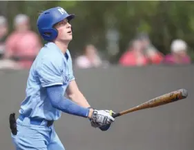  ?? STAFF PHOTO BY MATT HAMILTON ?? McCallie’s Hudson Calhoun watches the ball fly towards the outfield during their game against Ooltewah on Friday at Bradley Central High School in Cleveland.