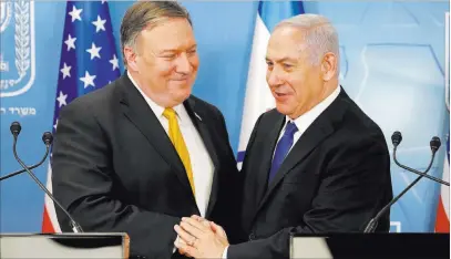  ?? Thomas Coex ?? The Associated Press Secretary of State Mike Pompeo, left, is greeted by Israeli Prime Minister Benjamin Netanyahu ahead of a news conference Sunday at the Ministry of Defense in Tel Aviv.