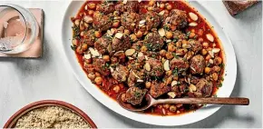  ?? THE WASHINGTON POST ?? To serve, top Algerian meatballs with toasted almonds and parsley.