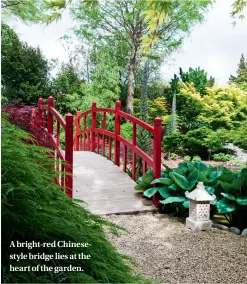  ??  ?? A bright-red Chinesesty­le bridge lies at the heart of the garden.