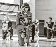  ?? Manuel Balce Ceneta / Associated Press ?? House Speaker Nancy Pelosi kneels in observance of George Floyd. Democrats have introduced the Justice in Policing Act, which deserves bipartisan considerat­ion and support.