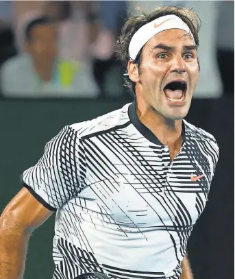  ?? CAMERON SPENCER, GETTY IMAGES ?? “This one is definitely a milestone inmy career, there’s no doubt about it,” Roger Federer, above, said about his 18th Grand Slam. Federer beat Rafael Nadal 6- 4, 3- 6, 6- 1, 3- 6, 6- 3 in Sunday’s Australian Open final.