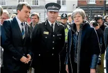  ?? PHOTO: AP ?? British Prime Minister Theresa May is shown the site in Salisbury where former Russian spy Sergei Skripal and his daughter were found critically ill.