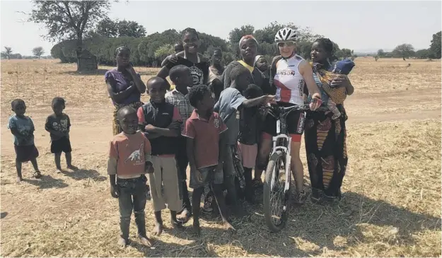  ??  ?? 0 Stirling cyclist Jayne Gray is pictured during the chariy ride in Zambia before the fatal accident