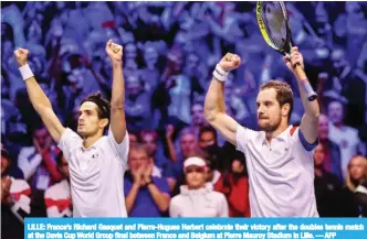  ??  ?? LILLE: France’s Richard Gasquet and Pierre-Hugues Herbert celebrate their victory after the doubles tennis match at the Davis Cup World Group final between France and Belgium at Pierre Mauroy Stadium in Lille. — AFP