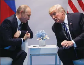  ?? EVAN VUCCI/The Associated Press ?? President Donald Trump speaks during a meeting with Russian President Vladimir Putin at the G20 Summit Friday, in Hamburg.