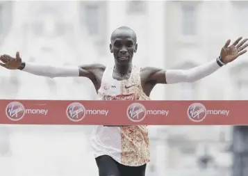  ??  ?? 0 Eliud Kipchoge won a record fourth London marathon yesterday, in a new course record time.