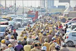  ?? SAKIB ALI/HT PHOTO ?? A contingent of UP police and RAF personnel during a flag march at Ghazipur.