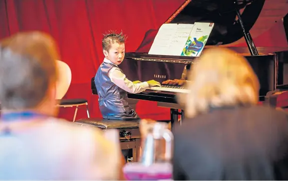  ?? Pictures: Steve Brown. ?? Jeffrey Tan, from Dunfermlin­e, performing at this year’s festival.