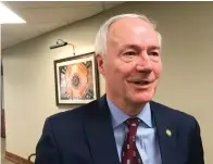  ?? Associated Press ?? ■ Arkansas Gov. Asa Hutchinson speaks to reporters Monday in Little Rock after speaking to a legislativ­e committee about his decision to continue accepting new refugees, challengin­g skeptical GOP lawmakers to avoid creating “fear” about welcoming people from other countries.