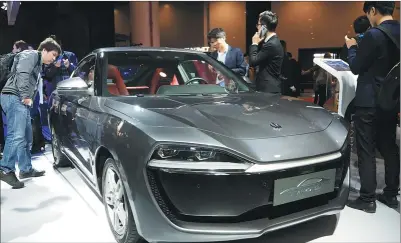  ?? HAO YAN / CHINA DAILY ?? Leap Motor, founded in December 2015, unveils its sub-compact full electric coupe on Nov 10 in Hangzhou, Zhejiang province.