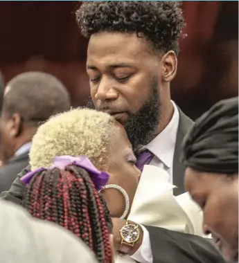  ??  ?? TOP: Kenneka Jenkins’ mother, Tereasa Martin, is comforted at the House of Hope Church Saturday. LEFT: Martin ( center), surrounded by family and friends, leaves the sanctuary after the funeral. LESLIE ADKINS/ PHOTOS FOR THE SUN- TIMES