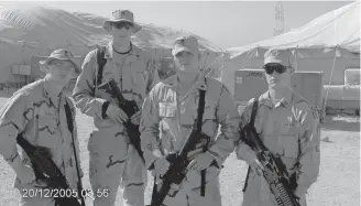  ?? [PHOTO COURTESY OF JUSTIN CLIBURN] ?? Justin C. Cliburn, left, Stephen Brosh, Justin Finch and Derek Baldwin pose for a photo in Kuwait in December 2005, a week before leaving to serve in Iraq.