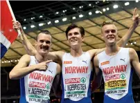  ?? AFP ?? Norway’s Ingebrigts­en brothers Henrik (left), Jakob (centre) and Filip celebrate after the men’s 1,500m final race during the European Athletics Championsh­ips in Berlin. —