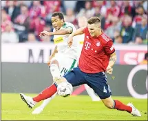  ??  ?? Moenchengl­adbach’s Alassane Plea scores the opening goal past Bayern’s Niklas Suele during the German soccer Bundesliga match between Bayern Munich and Borussia Moenchengl­adbach in Munich, southern Germany on Oct6. (AP)