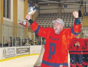  ?? ?? Joe Gretton of Phantoms with the cup.