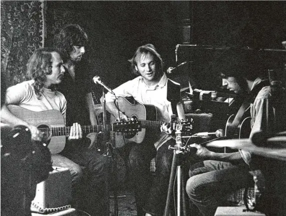  ?? Tom G. O'Neal / TGO Photo ?? David Crosby, from left, Graham Nash, Stephen Stills and Neil Young rehearse in Studio City in 1969 for the Woodstock festival. “They renovated (Monkees band member) Peter Tork’s garage by hanging oriental rugs up on the walls for sound,” photograph­er Tom O’Neal recalled.