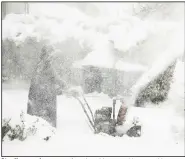  ?? (AP/The Buffalo News/Libby March) ?? Star Haynes clears snow from her driveway with a snowblower on Saturday in Buffalo, N.Y.