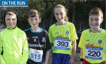  ??  ?? JP Fielding, Jack Delaney, Niamh O’Brien and Liam O’Brien taking part in the St Ibar’s Camogie Club 6K Run.