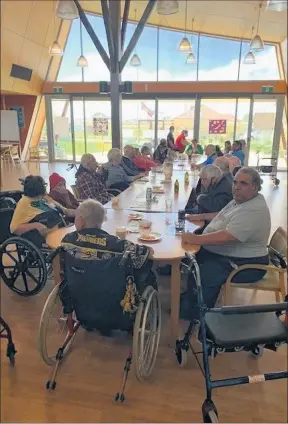  ?? ?? Meet and greet: Residents gather around the table for a catch up at Rumbalara Elders Facility.