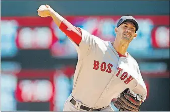  ?? [JIM MONE/THE ASSOCIATED PRESS] ?? Boston Red Sox pitcher Rick Porcello throws against the Minnesota Twins in the first inning Saturday in Minneapoli­s.